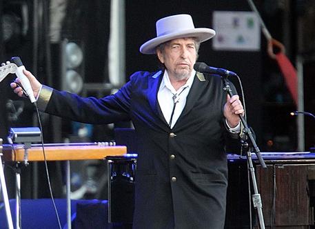 FILE - This July 22, 2012 file photo shows U.S. singer-songwriter Bob Dylan performing on stage at "Les Vieilles Charrues" Festival in Carhaix, western France.  The archives of Dylan have been acquired by the George Kaiser Family Foundation and the University of Tulsa and will be permanently housed in Tulsa. Kaiser Foundation director Ken Levit and university President Steadman Upham announced the acquisition Wednesday, March 2, 2016. (ANSA/AP Photo/David Vincent, file)