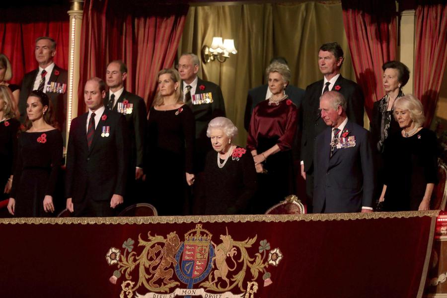 Britain's Queen Elizabeth II, centre, with from left front row, Kate, the Duchess of Cambridge, Prince William,Prince Charles and Camilla, the Duchess of Cornwall. Back row. second from left, Prince Edward, Sophie, the Countess of Wessex, the Duchess of Gloucester,  Tim Lawrence, and Princess Anne attend the annual Royal British Legion Festival of Remembrance, at the Royal Albert Hall in Kensington, London, Saturday, Nov. 9, 2019. (Chris Jackson/Pool Photo via AP)