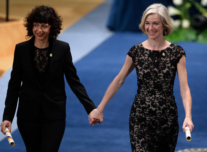 (FILES) This file photo taken on October 23, 2015 shows French researcher in Microbiology, Genetics and Biochemistry Emmanuelle Charpentier (L) and US professor of Chemistry and of Molecular and Cell Biology, Jennifer Doudna on the stage after receiving the 2015 Princess of Asturias Award for Technical and Scientific Reseach from Spain's King Felipe during the Princess of Asturias awards ceremony at the Campoamor Theatre in  Oviedo. - Emmanuelle Charpentier (France) and Jennifer Doudna (US) win the 2020 Nobel Chemistry Prize. (Photo by Miguel RIOPA / AFP)